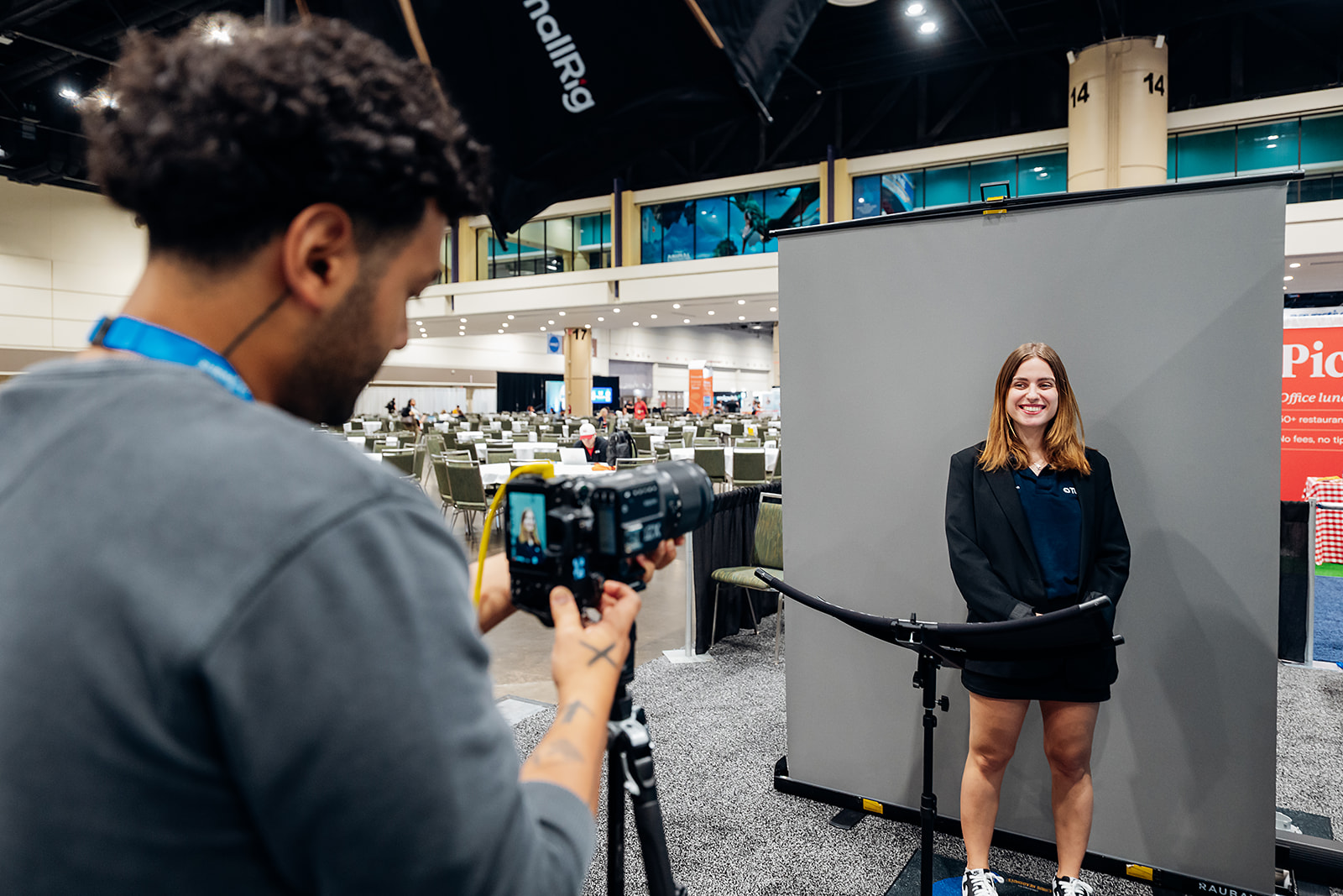 Close-up of a guest being photographed during a headshot lounge session